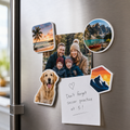 Custom die-cut white acrylic photo and logo magnets on a stainless fridge holding a note
