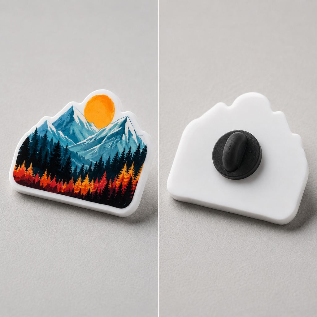 Front and back of a white acrylic pin showing flush UV print and butterfly-clutch pin back