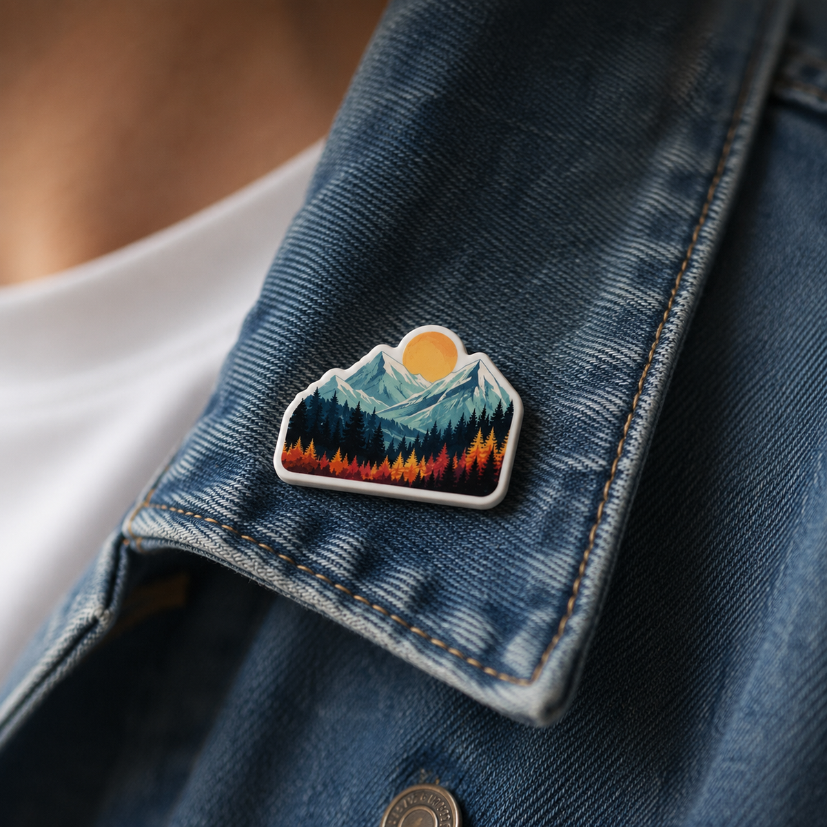 Custom white acrylic pin worn on a denim jacket lapel