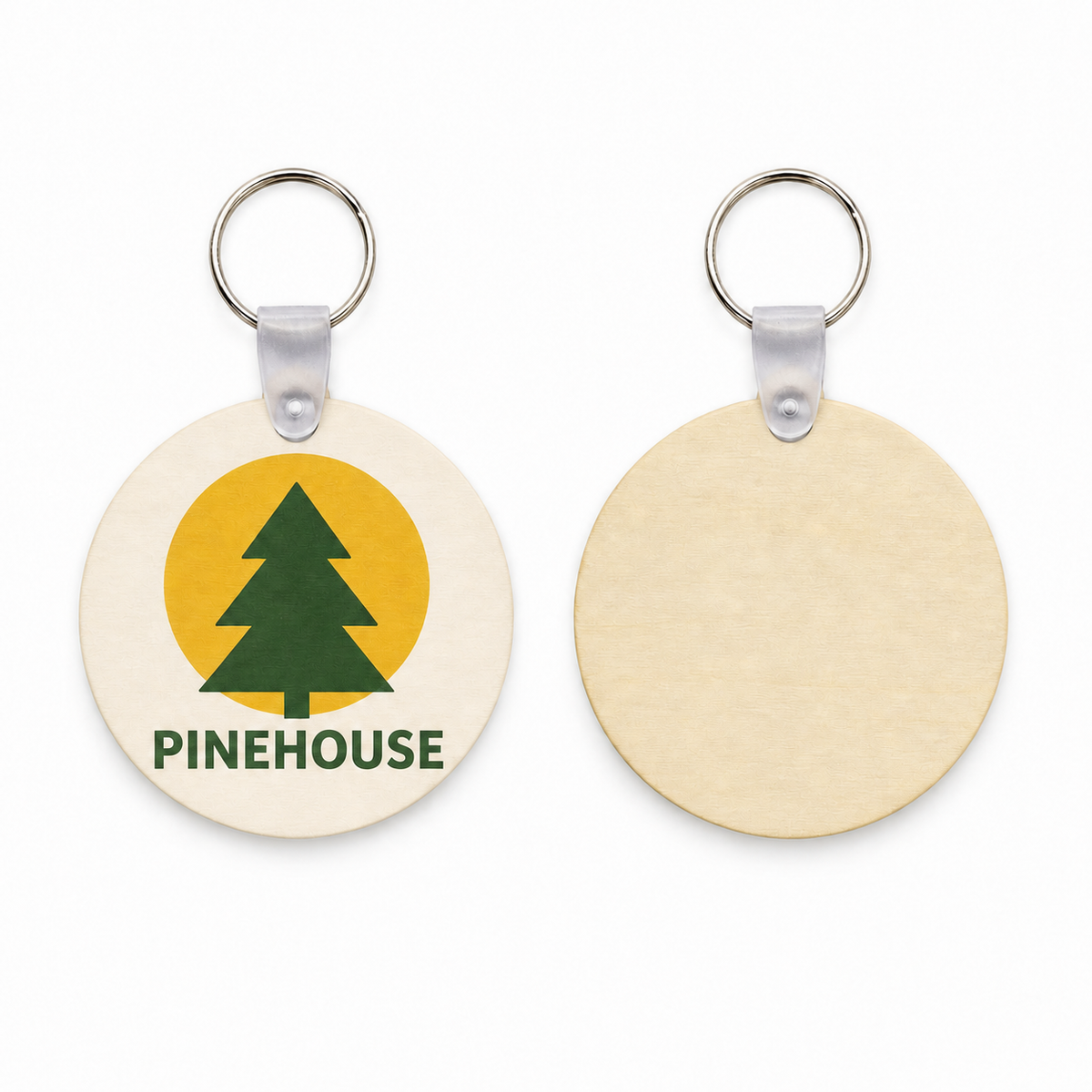 Front and back of a round birch keychain: full-color printed logo on the front, bare unprinted birch on the reverse